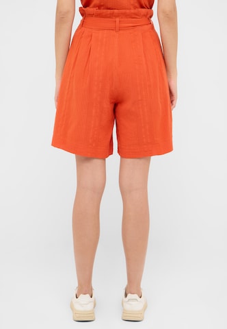 MUSTANG Loose fit Trousers in Orange