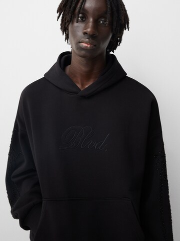 Sweat-shirt Bershka en noir