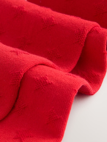 Next - Leotardos en rojo