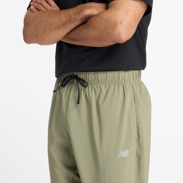 Effilé Pantalon de sport new balance en vert