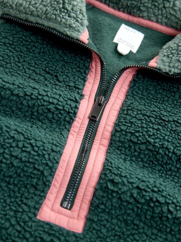 Next Fleecejacka i grön