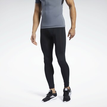 Reebok - Skinny Calças de desporto em preto: frente