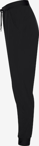 UNDER ARMOUR Tapered Sportbroek in Zwart