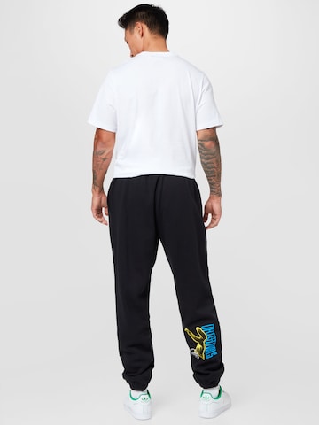 ADIDAS ORIGINALS Tapered Pants 'Graphics Unite Sweat' in Black