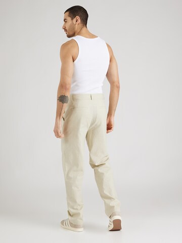 ABOUT YOU x Kevin Trapp Loose fit Pleat-front trousers 'Kimi' in Beige