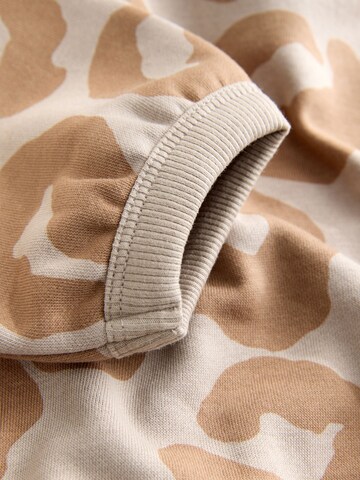 Next Облекло за бягане в бежово