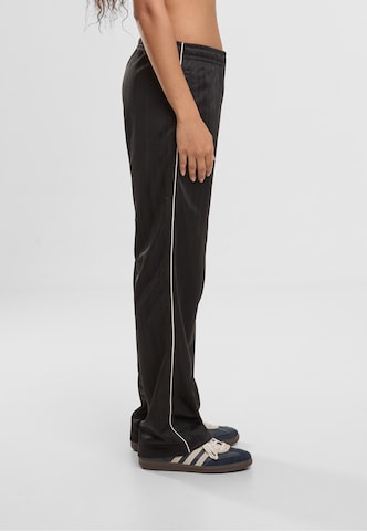 regular Pantaloni di Karl Kani in nero