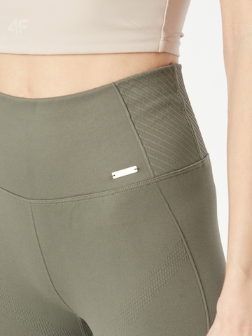 aim'n - Skinny Calças de desporto 'MOTION' em verde