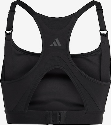 ADIDAS PERFORMANCE Medium Support Urheilurintaliivit 'Powerimpact' värissä musta