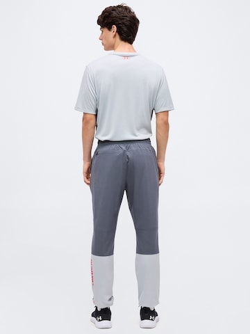 UNDER ARMOUR Tapered Sportbroek 'Tech Utility' in Grijs