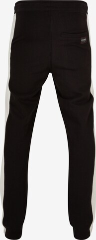 Loosefit Pantaloni di ROCAWEAR in nero