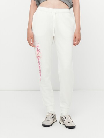 Tapered Pantaloni 'CLUB FLC' de la Nike Sportswear pe albastru: față