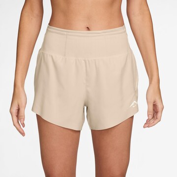 NIKE Regular Athletic Pants 'Trail DF' in Beige: front