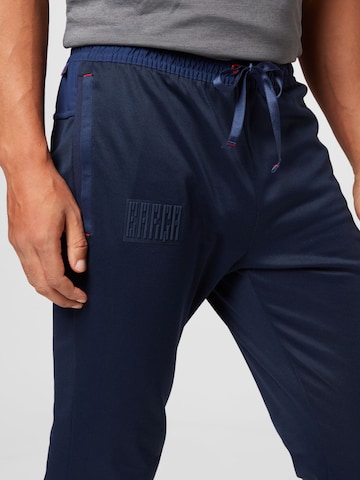 NIKE Tapered Sports trousers in Blue