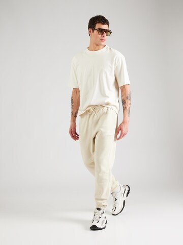 Tapered Pantaloni 'CLUB' di Nike Sportswear in verde