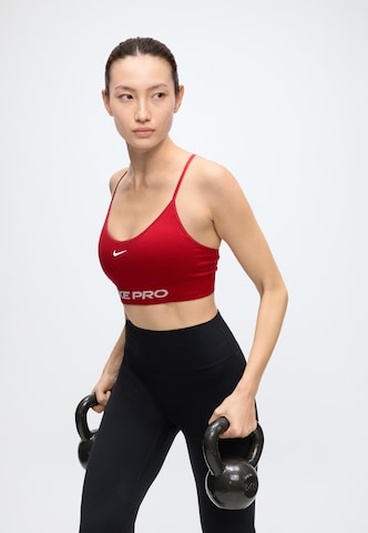 NIKE Bygelfri Sportbehå 'Pro' i röd