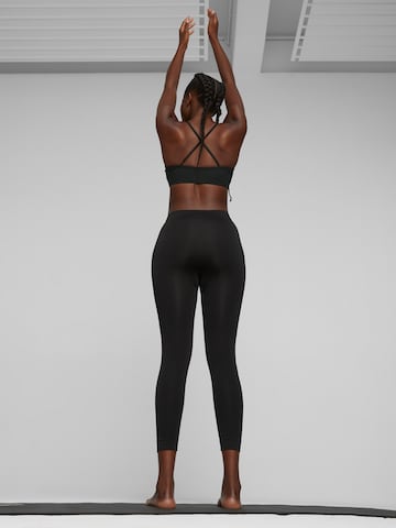 PUMA Skinny Spodnie sportowe 'Studio Foundation' w kolorze czarny