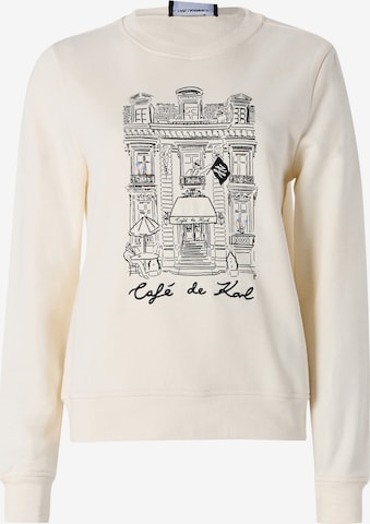 Karl LagerfeldSweater majica 'Karl Lagerfeld x Jorge Parra' - bež boja: prednji dio