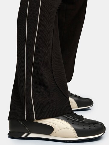 PUMA Regular Sporthose 'T7' in Schwarz