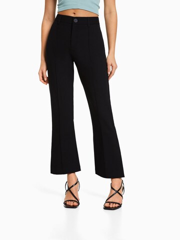 Bershka Flared Pants in Black: front