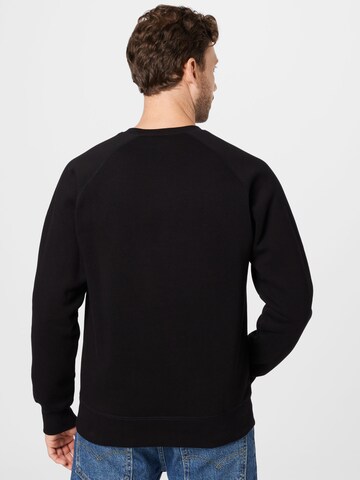 Carhartt WIPSweater majica 'Chase' - crna boja