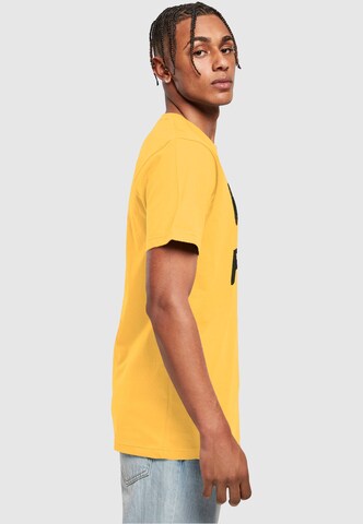 T-Shirt 'Peanuts - Rebel with paws' Merchcode en jaune