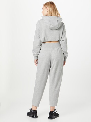 Effilé Pantalon 'PHNX FLC' Nike Sportswear en gris