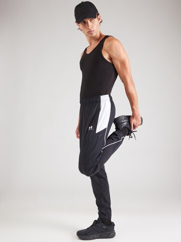 UNDER ARMOUR Конический (Tapered) Спортивные штаны 'Challenger' в Черный