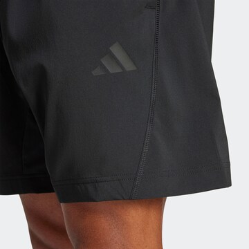 Largi Pantaloni sport 'City Escape' de la ADIDAS SPORTSWEAR pe negru