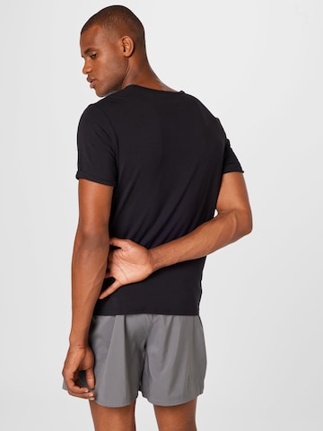 T-Shirt fonctionnel 'Flow' CURARE Yogawear en noir