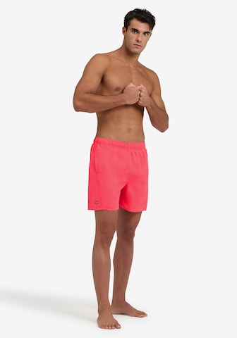 ARENA Athletic Swim Trunks in Pink