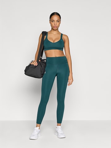 Bustieră Sutien sport 'PWRSHAPE' de la PUMA pe verde