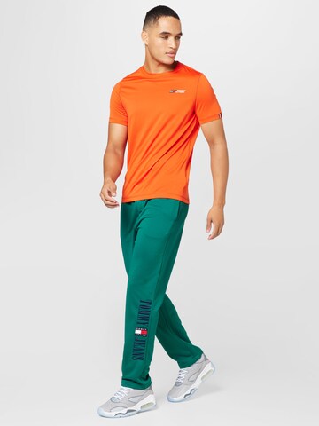 Tommy Jeans Regular Pants 'Ethan' in Green