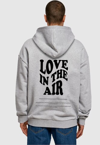 Sweat-shirt 'Love In The Air' Merchcode en gris