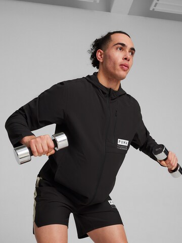 PUMA Športna jakna 'Ultraweave Hooded' | črna barva: sprednja stran