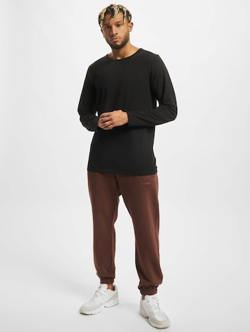 ruda ADIDAS ORIGINALS Siaurėjantis Kelnės 'Trefoil A33'