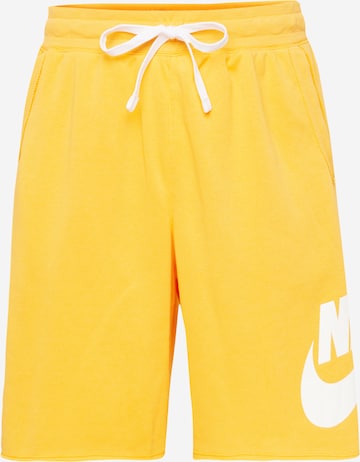 Pantaloni 'CLUB ALUMNI' de la Nike Sportswear pe portocaliu: față