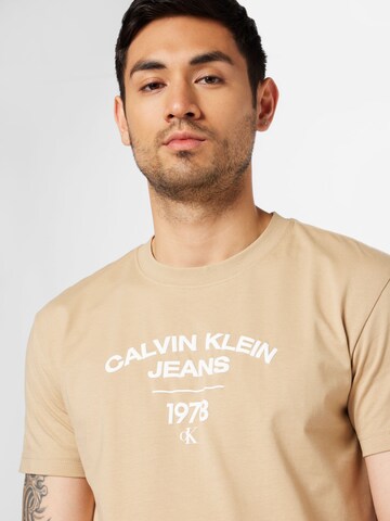 Calvin Klein Tričko 'Varsity' – béžová