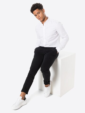 Coupe slim Pantalon 'TRANSIT 4.' Tiger of Sweden en noir