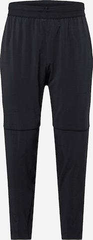 NIKE Tapered Sports trousers in Black: front