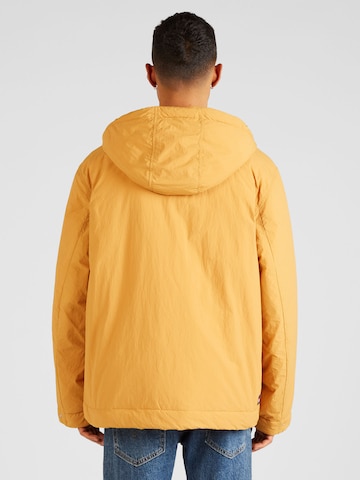 Tommy JeansPrijelazna jakna 'Chicago' - žuta boja