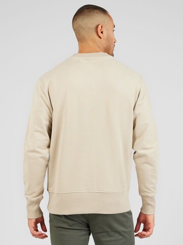 Bluză de molton de la Calvin Klein Jeans pe bej
