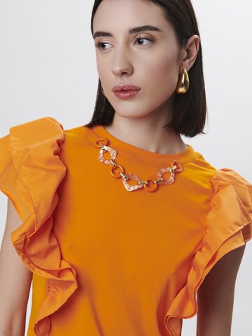 Haut Influencer en orange