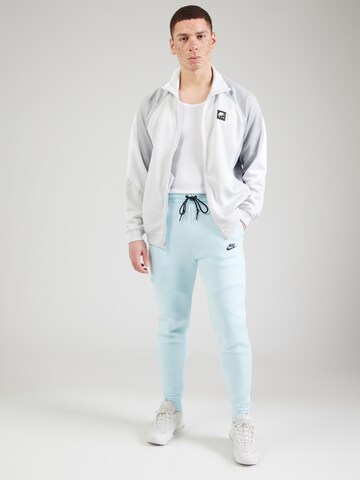Nike Sportswear Tapered Nadrág 'TCH FLC' - kék