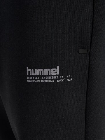 Effilé Pantalon de sport Hummel en noir