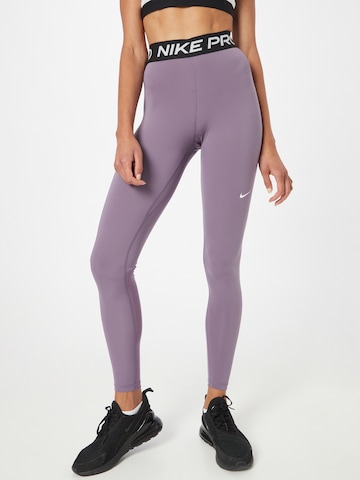 Skinny Pantalon de sport NIKE en violet : devant