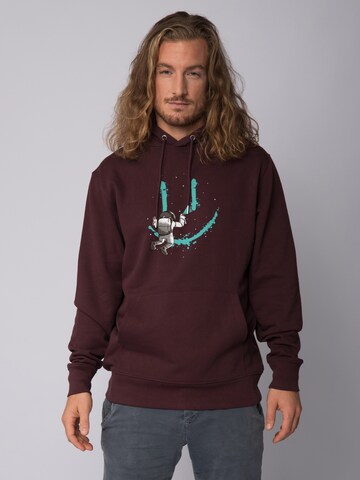Sweat-shirt ' Graffiti Astronaut ' Watapparel en rouge : devant