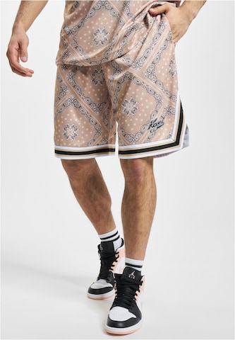 Karl Kani - Loosefit Pantalón en beige: frente