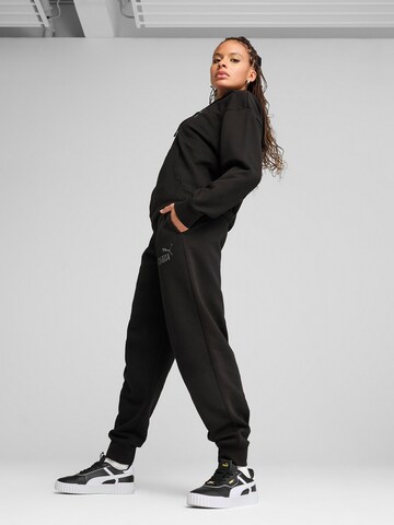 PUMA - Tapered Pantalón deportivo 'Ess Nature 2.0' en negro