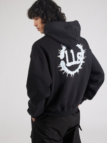 Low Lights Studios Sweatshirt 'Neutron Star' i svart: framsida